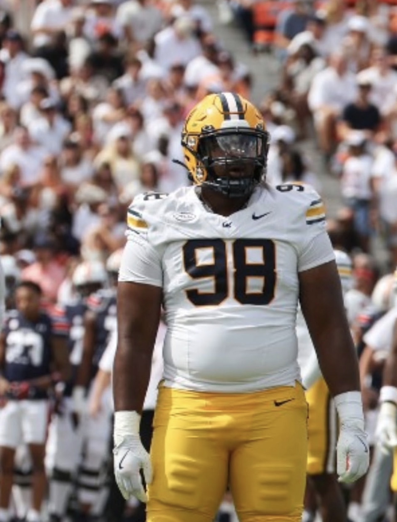 College defensive lineman number 98 on the field